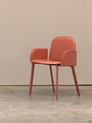 Detail of the Makalu leather chair with armrests characterised by rounded shapes