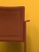 Detail of the Katla leather chair back and armrests folded outwards
