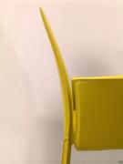 Detail of the armrests and slender, slightly backward-sloping backrest