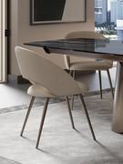 Rear view of the Niva chair, with conical metal legs in customisable finish