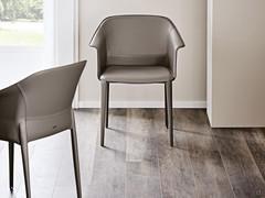 Zuleika armchair by Cattelan upholstered in leather, with slightly curved armrests and integral part of the backrest