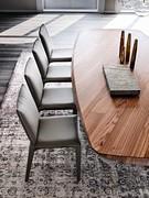 Penelope chairs by Cattelan upholstered in leather, combined with Mad Max table with Masterwood top