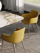 Back and side view of the Count upholstered chair with armrests in the armchair version with champagne-painted metal legs