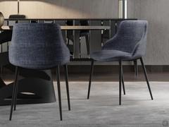 Rear and three-quarter view of the Count upholstered chair with armrests, here proposed with fabric-covered shell and black painted metal frame to match the table base
