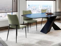 Bell upholstered designer chair with Wave econabuk upholstery and black painted metal frame to match the Trevor table base