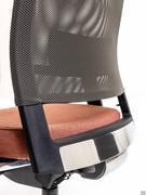 Detail of the backrest support structure made of black plastic with polished aluminium inserts and covered in mesh