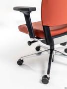 Detail of the height- and depth-adjustable armrest with swivel support and polished aluminium attachment matching the base and details