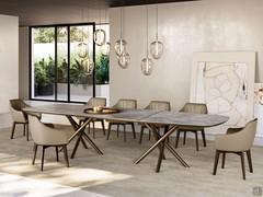 Gladys chairs in the version with revolving wooden trestle base; comfortable upholstered seat with armrests