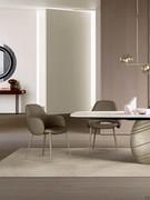 Camille armchair with armrests, with upholstered seat covered in leather, fabric or imitation leather and slender tubular metal legs