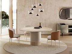 Piper chairs with two-tone upholstery in shades of cream and brick, coordinated with ivory painted metal legs