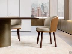 Piper wooden leg chair with two-tone leather and fabric upholstery