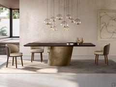 Two-tone Piper armchairs here proposed in combination with the Clifford table with wooden top matching the chair legs