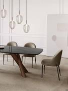 Wendy chair with black chrome metal legs and leather-covered shell