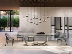 Wendy living room chairs with refined lines, shown here in the version with metal legs and leather and fabric upholstery