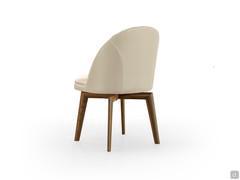 Detail of the swivelling wooden base with the 4 legs that join in the centre and support the upholstered shell