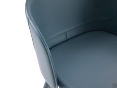 Detail of the curved backrest hugging the seat panel