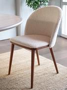 Olimpia chair with curved, wrap-around backrest