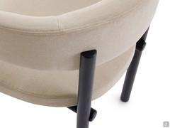 Rear view showing the detail of where the upholstered element of the back and armrests engages with the wooden frame