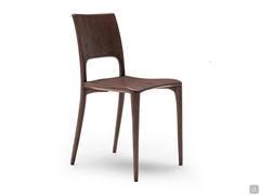 Carmen solid oak chair, shaped by hand and crafted from solid wood. Here offered in one of the dark colours, cocoa oak