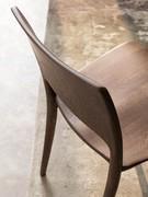 Detail of the back of the Carmen chair, with backrest and rear legs made from a single piece of hand-formed oak