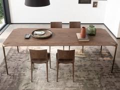 Carmen chairs in walnut-stained oak finish, combined with the walnut top of the Belem table