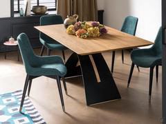 Clara chairs upholstered in fabric, with solid black ash frame and lacquered brass tips
