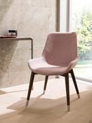 Clara chair upholstered in fabric or velvet, with frame in natural solid ash, stained or open-pore matt lacquered in RAL and NCS colours
