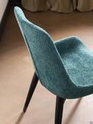 Detail of the back in bouclé fabric, upholstered like the seat and not removable