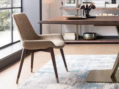 Clara chair in fabric version, with solid coffee-stained frame and lacquered brass tips