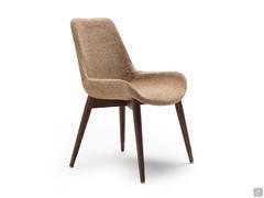 Clara fabric and ash chair, with curved, wrap-around seat 45 cm high from the floor. Solid wood legs, painted steel tips