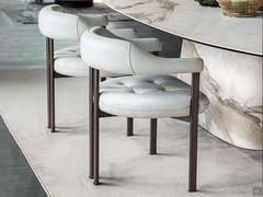 Greta upholstered armchair by Cattelan, covered in leather with embossed metal frame GFM18 bronze