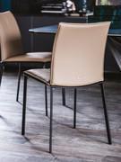 Rita chair with curved backrest and slanted legs