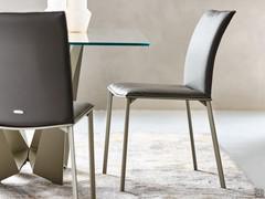 Upholstered Rita chair by Cattelan upholstered in leather with titanium-embossed metal frame matching the table base