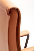 The back padding gently 'folds' over the top. Matching stitching embellishes the upholstery profile