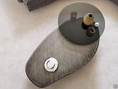 Arena Long coffee table with swivel top in smoked bevelled glass and elongated base in brushed grey lacquer
