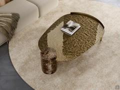 Piece coffee table in shaped version, with hammered bronze glass top and Emperador marble column