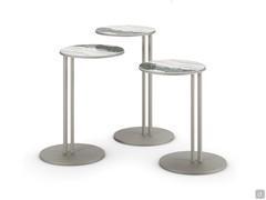 Three Sting tables in the 31 cm diameter version, in the three available heights