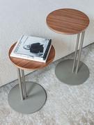 Detail of the Sting coffee tables in the Canaletto walnut version, with titanium painted frame
