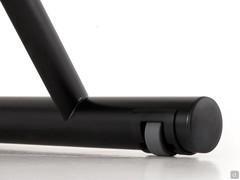 Detail of the castors integrated in the legs that facilitate raising and moving the Lucas table