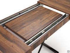 Detail of the table top that opens centrally and hides the extensions inside