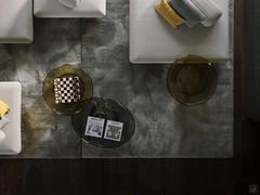 Top view of a set of Blur coffee tables in round and elliptical formats, shown here in possible use in a sofa-front composition