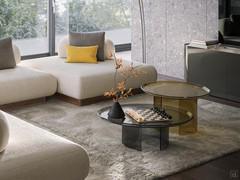 Pair of Blur coffee tables facing the sofa in different colours, perfectly placed in an elegant and modern living area