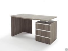Detail of the computer desk with a practical, big chest of drawers working as a support