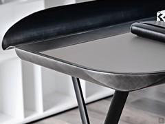 Detail of the leather top of the Cocoon desk, with undercounter and storage groove in brushed grey finish