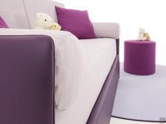 Jolly fabric bolster cushion used as a sofa armrest