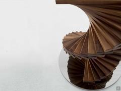 Detail of the spiral structure made of solid wood walnut Canaletto slats 