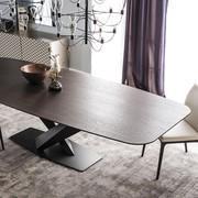 Detail of the barrel-shaped wooden top in burnt oak of the Stratos table by Cattelan