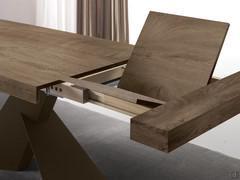 Trevor table with Syncro mechanism: the extensions are stored within the undertop structure