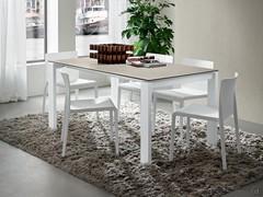 Davis fixed model table with Salt Fokos Laminam stone top 