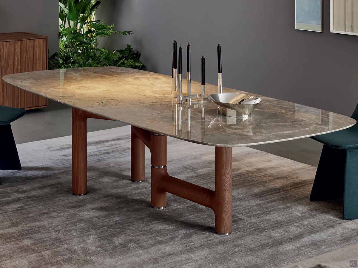 Fixed table with Bonaldo Pivot stone top and asymmetrical walnut wood base